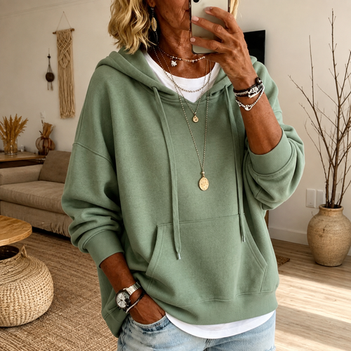 Charlotte: saliegroene oversized hoodie met kangoeroezak