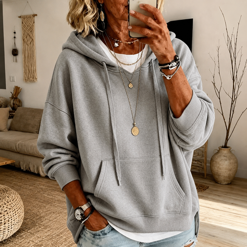 Anouk: lichtgrijze oversized hoodie met kangoeroezak